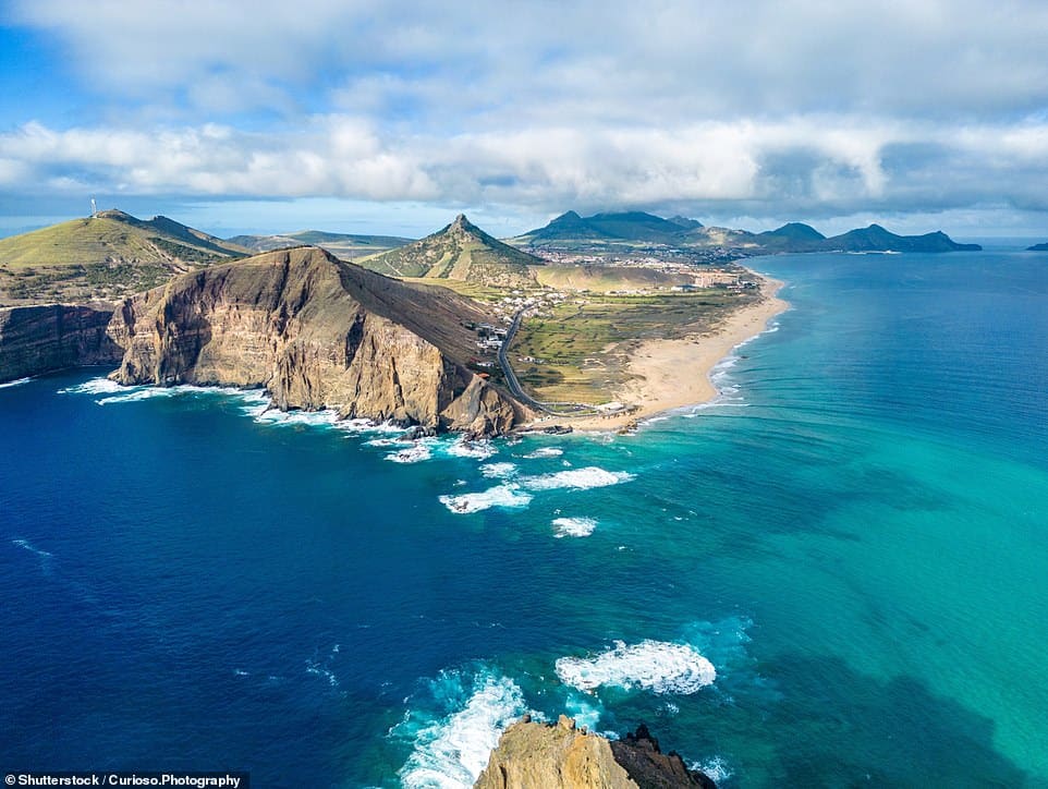 ОСТРОВ ПОРТУ-САНТУ: Эксперты туристической платформы HomeToGo рассказали MailOnline Travel: «Остров Порту-Санту, расположенный недалеко от побережья Мадейры, известен своими 9-километровыми [5.6-mile] полоса мягкого золотистого, богатого минералами песка и теплой бирюзовой воды. Вулканические вершины внутри страны создают потрясающие пейзажи, вокруг которых можно увидеть уникальные скальные образования и древние ветряные мельницы.